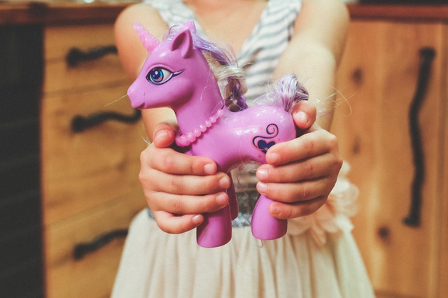 Child's Hands Holding My Little Pony